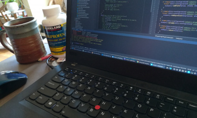 Laptop with coffee and pills